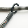 textile rope with a gray-black pattern through one of the two rubberised metal loops of the 'tex–lock eyelet'