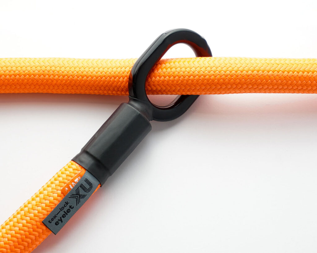 orange textile rope through one of the two rubberised metal loops from tex–lock eyelet